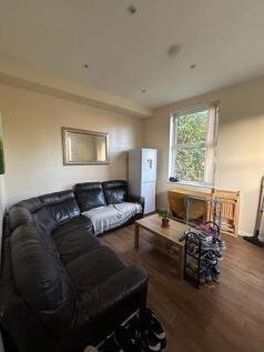 Bright and welcoming living room featuring larg...