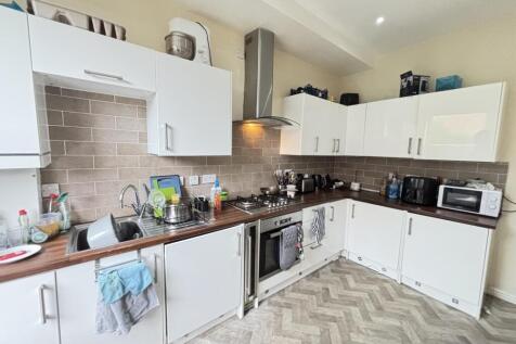 Bright and modern kitchen with ample workspace,...