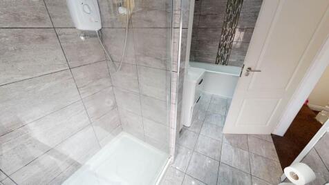 A clean and well-maintained bathroom featuring ...