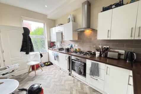 Bright and tidy kitchen with modern appliances ...