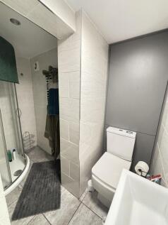 A clean and well-maintained bathroom featuring ...