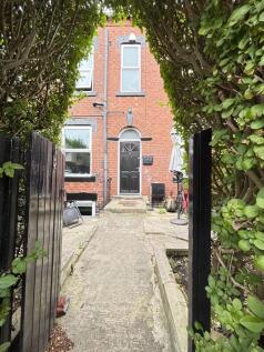 A charming view of the front of a classic brick...