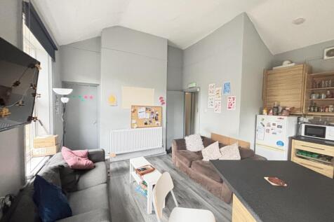 A bright and spacious living room with modern f...