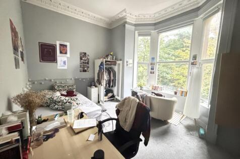 Bright and airy living room with large windows ...
