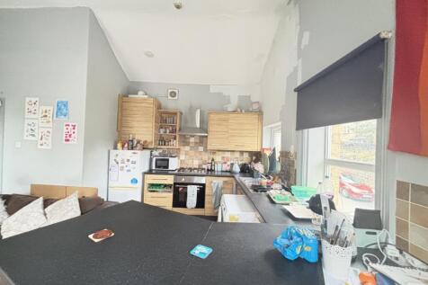 A functional kitchen area with various applianc...