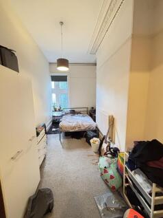 A cozy bedroom with a double bed, minimal natur...