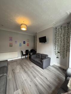 Bright and inviting living room featuring a com...