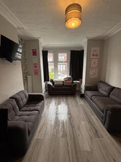 Bright and inviting living room with comfortabl...