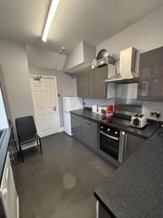 A modern and well-maintained kitchen with sleek...