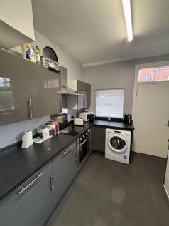 A well-maintained kitchen area with ample count...