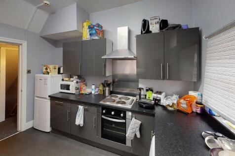 A well-equipped kitchen featuring modern applia...