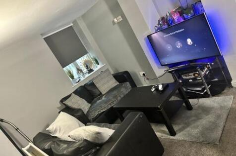 A modern, well-maintained living room featuring...