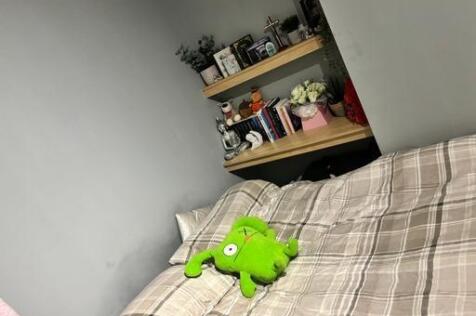 A cozy bedroom featuring a comfortable bed and ...