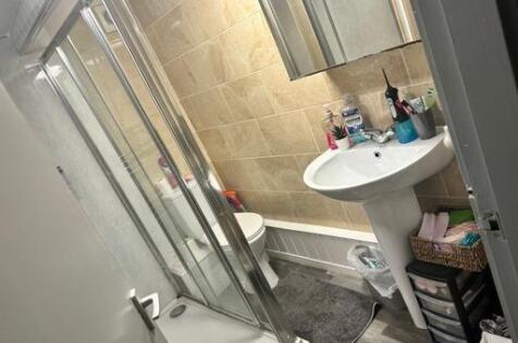 A clean and well-maintained bathroom with a lar...