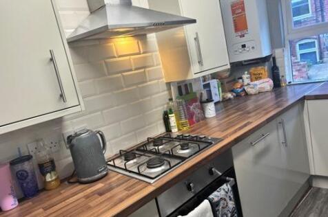 Modern kitchen area with ample countertop space...
