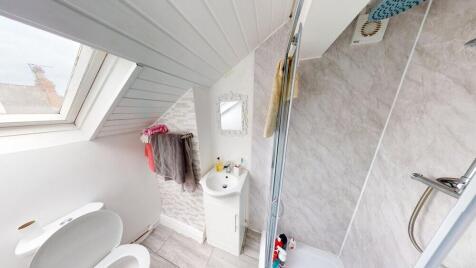 Bright and clean bathroom with a modern shower,...
