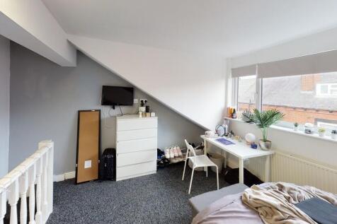 Bright and welcoming living room with ample nat...