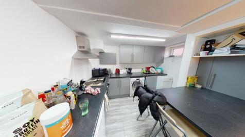 A well-equipped kitchen with ample counter spac...