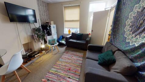 Bright, welcoming communal lounge with two sofa...
