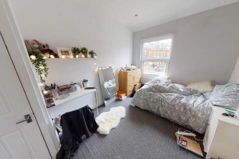Bright and spacious double bedroom featuring a ...