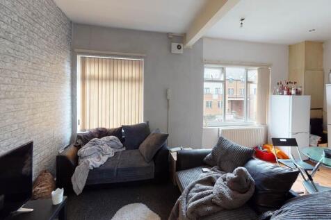 A modern and spacious living room filled with n...