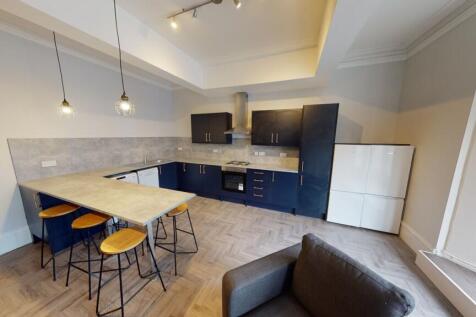 Modern kitchen with ample cabinetry, a breakfas...