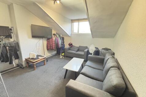 A spacious and well-maintained living room with...