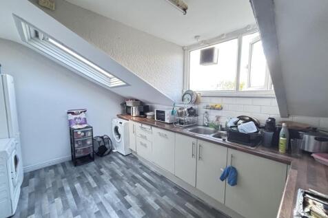 Bright and well-maintained kitchen area with am...