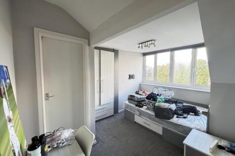 Bright and inviting master bedroom with ample n...