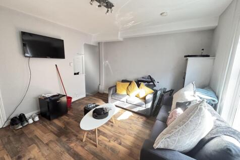 A bright and inviting living room featuring mod...