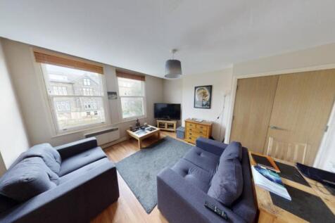 A spacious and inviting contemporary living roo...