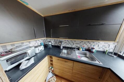 Bright and modern kitchen area with ample count...