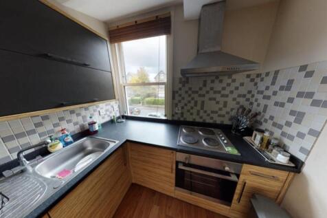A bright and modern kitchen with ample counter ...