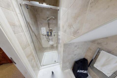 A clean and well-maintained bathroom with a lar...