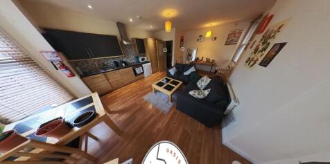 A spacious and welcoming living room with moder...