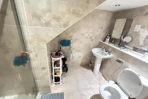 A well-maintained bathroom with a clean sink an...