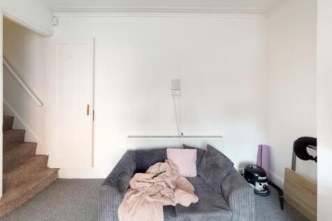 A modern living room with a comfortable sofa an...