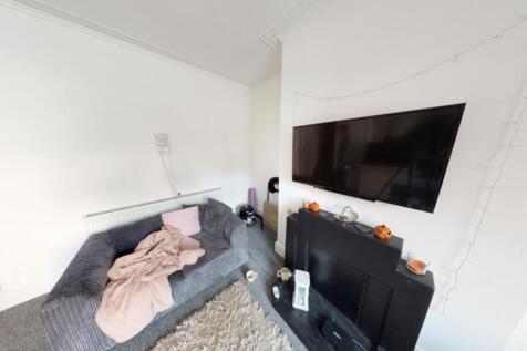 Bright and welcoming living room with large win...