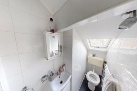 Bright and clean bathroom with modern fixtures ...