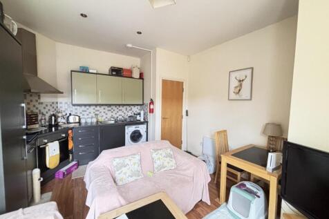 A cozy and inviting living room with natural li...