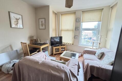 Bright and welcoming living room filled with na...