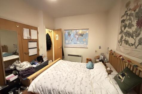 A cozy bedroom featuring a double bed with deco...