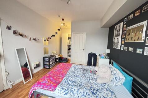 Bright and inviting bedroom featuring a comfort...