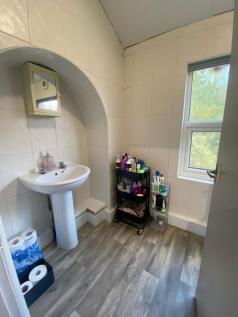 A bright and clean bathroom featuring a classic...