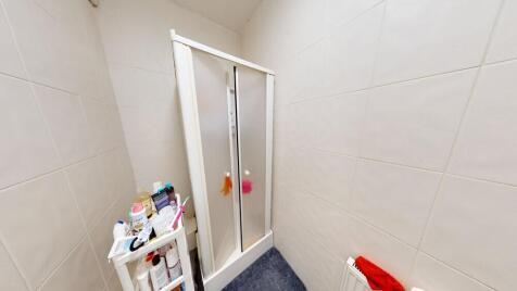 Bright and clean bathroom featuring a spacious ...
