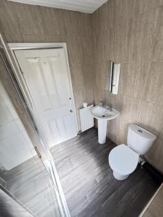 A clean, well-maintained bathroom with a modern...