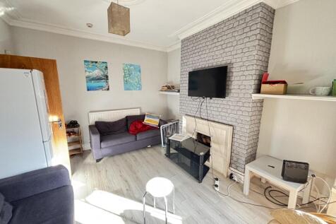 Bright and welcoming living room featuring mode...