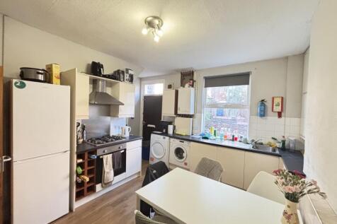 Bright and functional kitchen with ample natura...