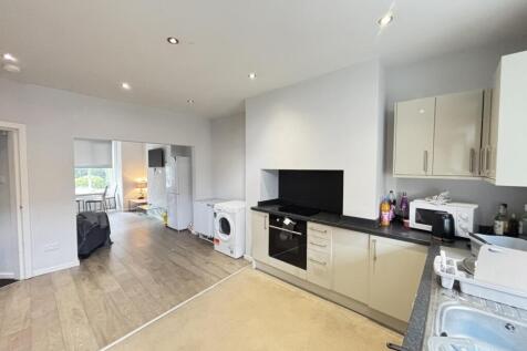 Bright and modern kitchen with ample natural li...