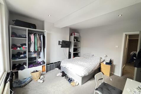 Bright and spacious master bedroom featuring a ...